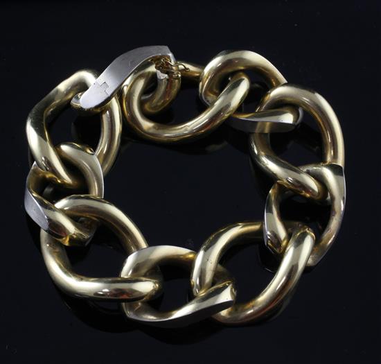 A stylish 18ct two colour gold large curb link bracelet, 8in.